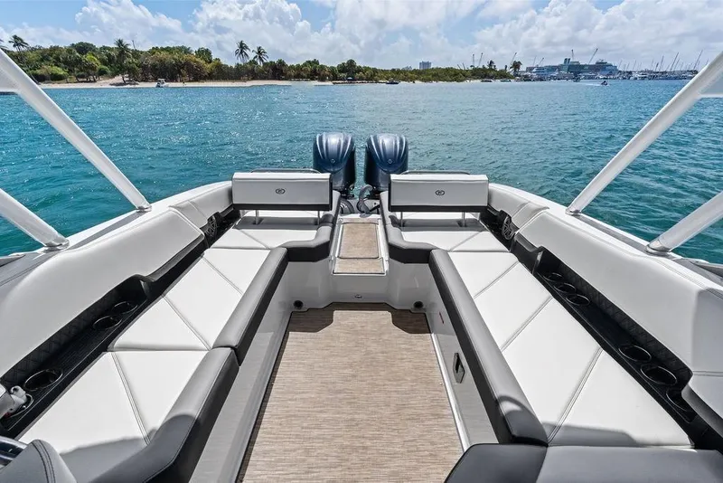 Slide: The Image of 2022 Cobalt R8 Outboard boat interior with spacious seating, overlooking serene blue waters. - 28