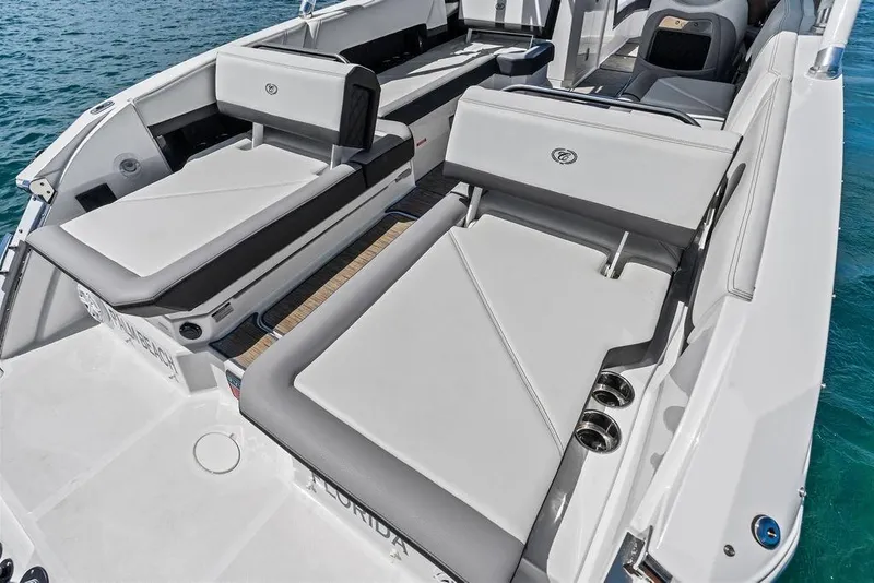 Slide: The Image of 2022 Cobalt R8 Outboard boat interior with luxurious seating on the water. - 32