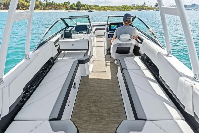 Slide: The Image of 2022 Cobalt R8 Outboard boat interior with spacious seating and modern design on a sunny day. - 34