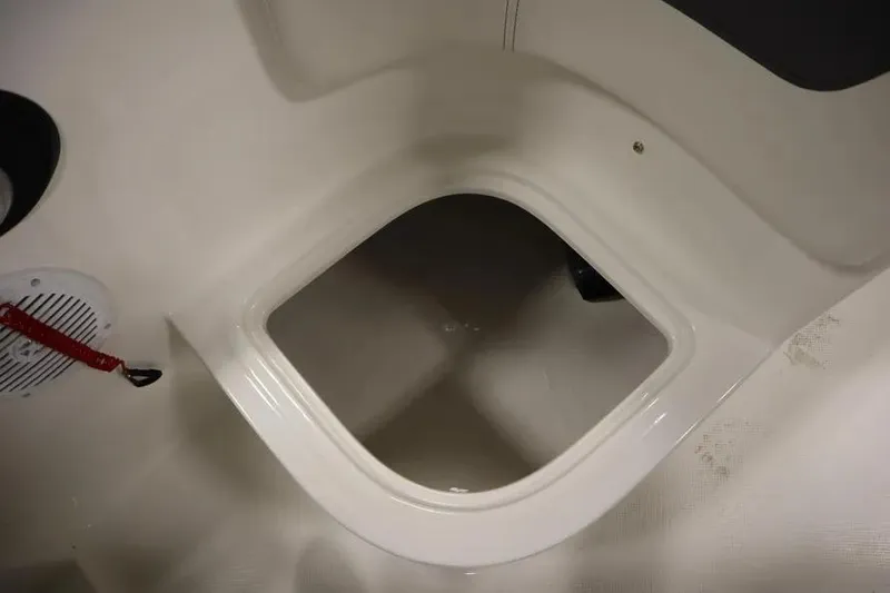 Slide: The Image of 2025 Bayliner Element E18 boat interior storage compartment. - 12
