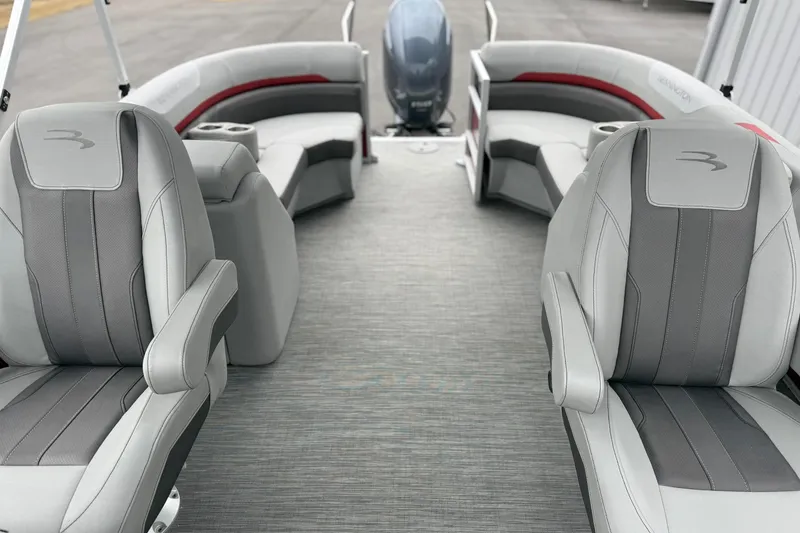 Slide: The Image of 2023 Bennington 22 SX Quad Bench interior with gray seating and modern design. - 7