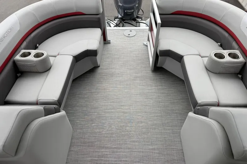 Slide: The Image of 2023 Bennington 22 SX Quad Bench interior with gray seating and cup holders. - 8