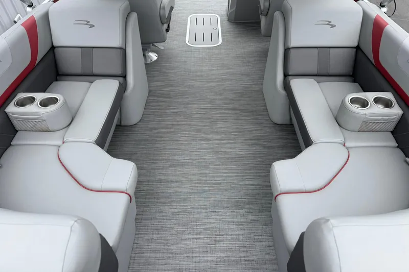 Slide: The Image of 2023 Bennington 22 SX Quad Bench interior with gray seating and cup holders. - 9