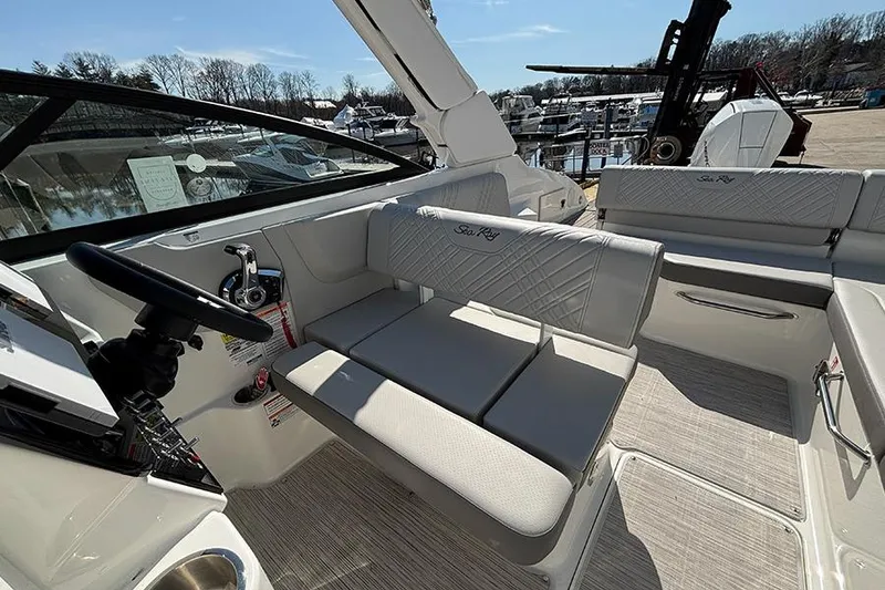 Slide: The Image of 2026 Sea Ray SDX 250 Outboard boat interior with luxurious seating and modern controls. - 12