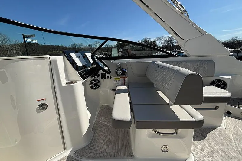 Slide: The Image of 2026 Sea Ray SDX 250 Outboard boat interior with modern helm and seating. - 13