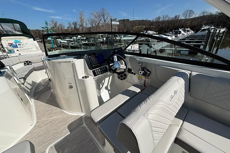 Slide: The Image of 2026 Sea Ray SDX 250 Outboard boat interior with modern helm and seating. - 14