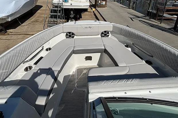 Slide: The Image of 2026 Sea Ray SDX 250 Outboard boat interior with spacious seating and modern design. - 19