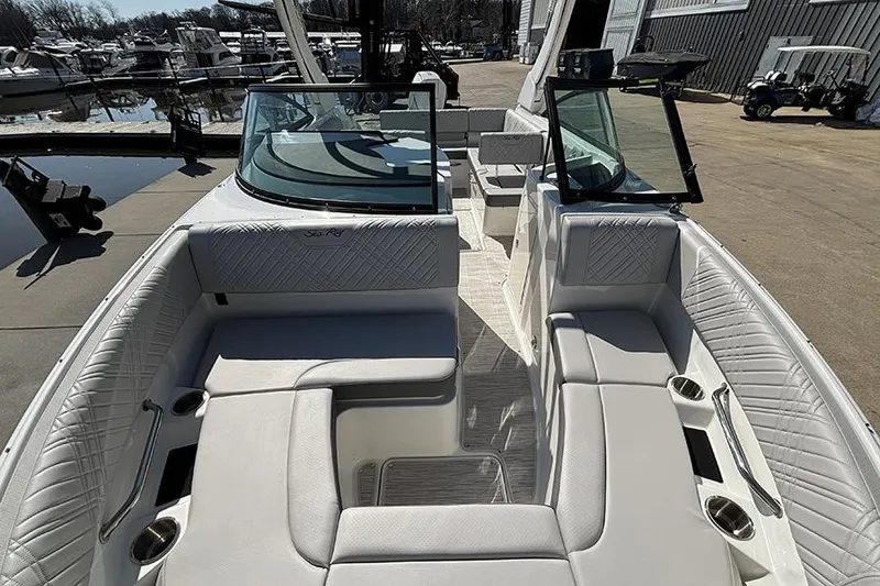 Slide: The Image of 2026 Sea Ray SDX 250 Outboard boat interior with luxurious seating and cup holders. - 22