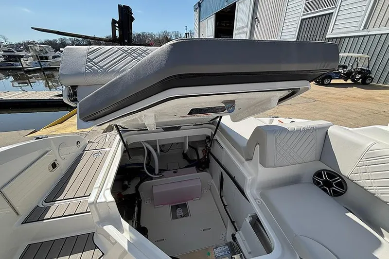 Slide: The Image of 2026 Sea Ray SDX 250 Outboard boat interior with open storage compartment. - 25