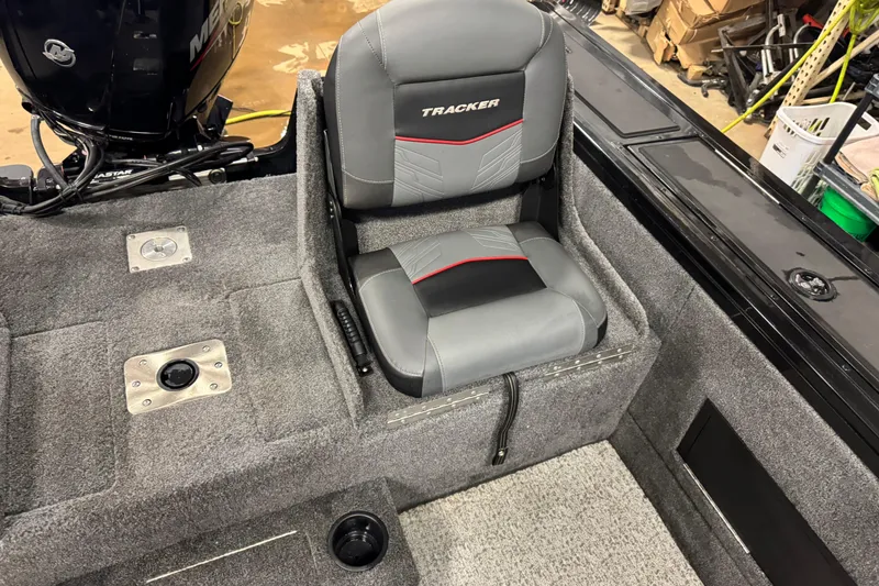 Slide: The Image of 2024 Tracker Targa V-18 Combo boat seat with gray upholstery and red accents. - 11