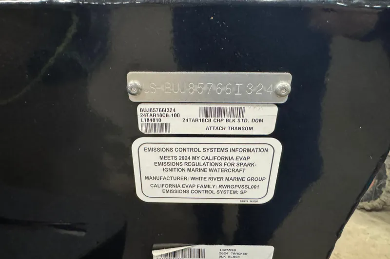 Slide: The Image of 2024 Tracker Targa V-18 Combo emissions control information plate on black surface. - 5