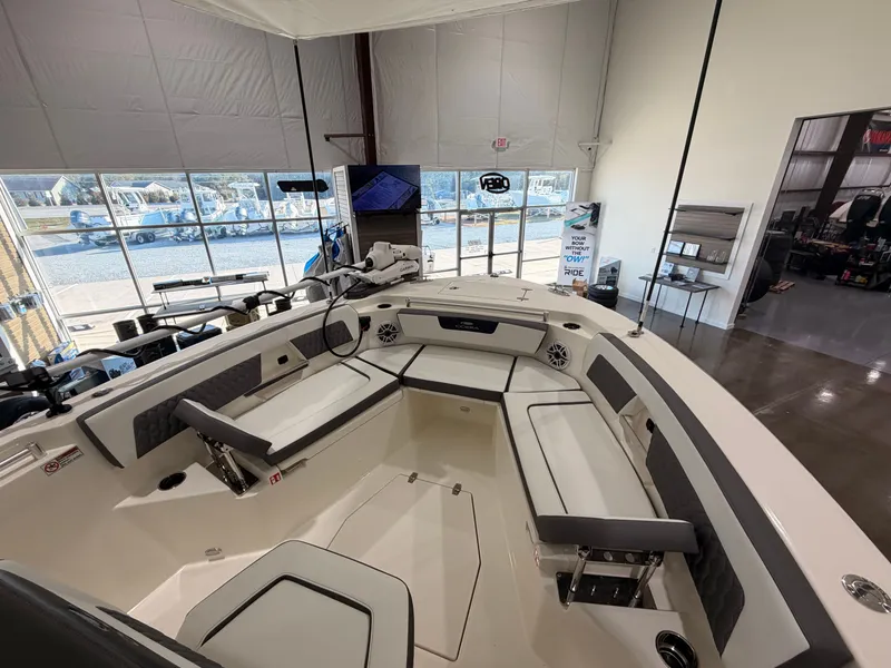 Slide: The Image of Interior view of 2026 Cobia 245 Center Console boat in showroom. - 17