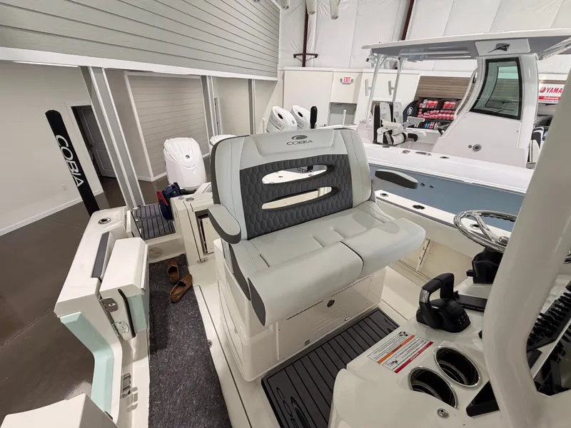 Slide: The Image of 2026 Cobia 245 Center Console in showroom. - 21