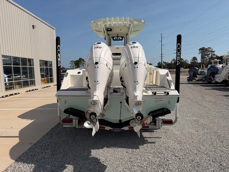 Slide: The Image of 2026 Cobia 245 Center Console with dual outboard engines. - 4