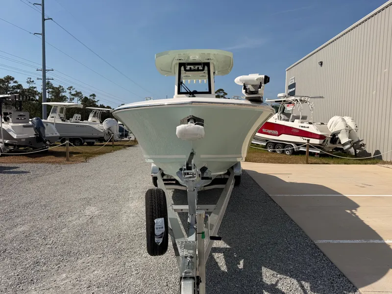 Slide: The Image of 2026 Cobia 245 Center Console on trailer outdoors. - 8