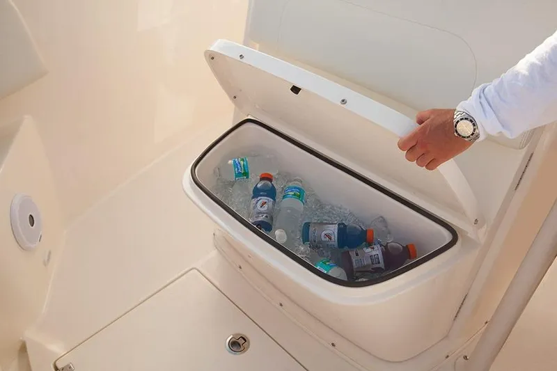 Slide: The Image of Manufacturer Provided Image: Built-in cooler with drinks on a 2017 Cobia 277 Center Console boat. - 11