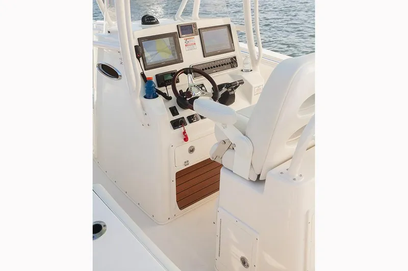 Slide: The Image of Manufacturer Provided Image: 2017 Cobia 277 Center Console boat helm with dual displays and controls. - 12