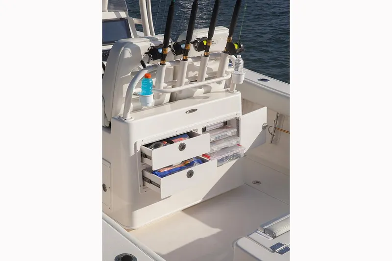 Slide: The Image of Manufacturer Provided Image: 2017 Cobia 277 Center Console fishing rod holders and storage drawers. - 17