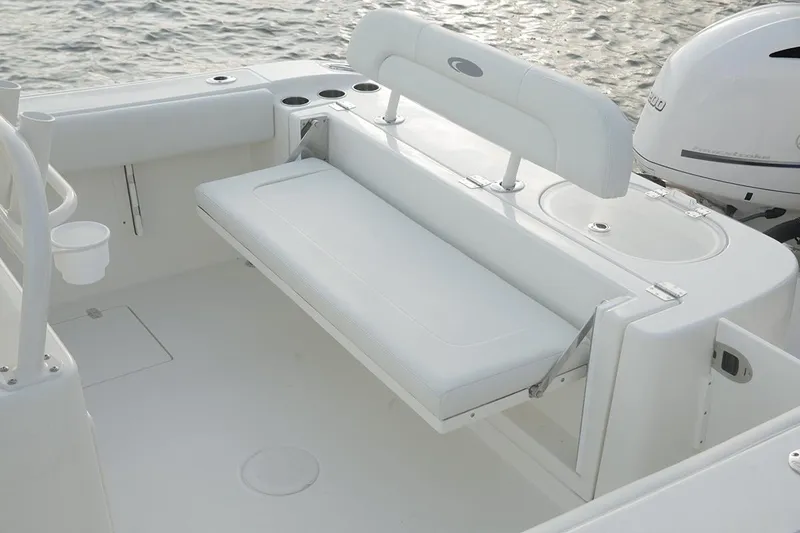 Slide: The Image of Manufacturer Provided Image: 2017 Cobia 277 Center Console boat with fold-down seating and cup holders. - 21
