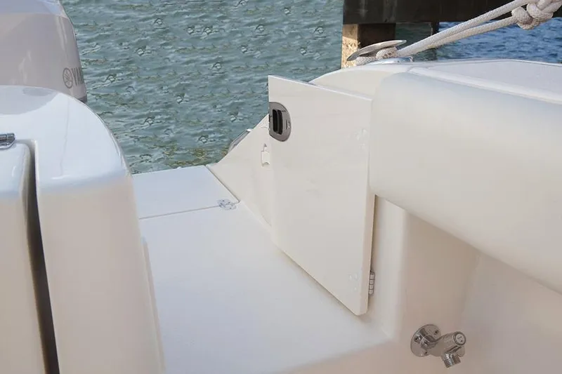 Slide: The Image of Manufacturer Provided Image: 2017 Cobia 277 Center Console boat deck with storage compartment. - 23