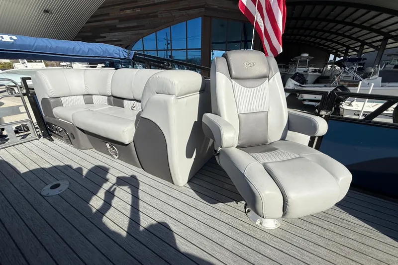 Slide: The Image of 2020 Ranger 2300LS boat interior with gray seating and American flag. - 12