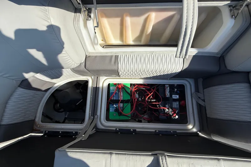 Slide: The Image of 2020 Ranger 2300LS boat interior showing battery compartment and storage area. - 18