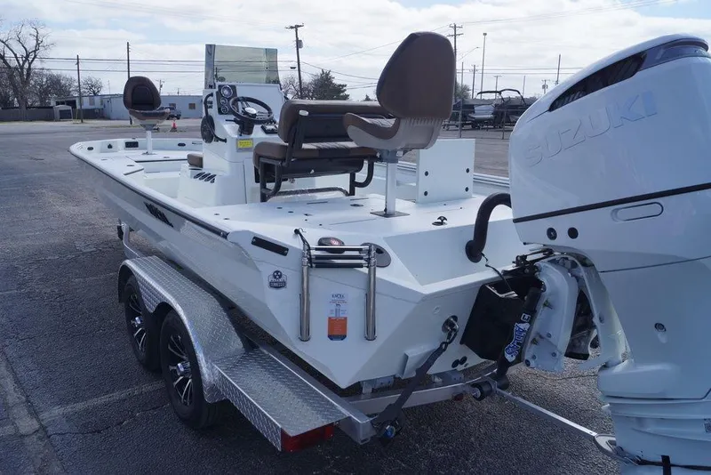 Slide: The Image of 2026 Excel 230 Bay Pro Elite boat on trailer with Suzuki outboard motor. - 19
