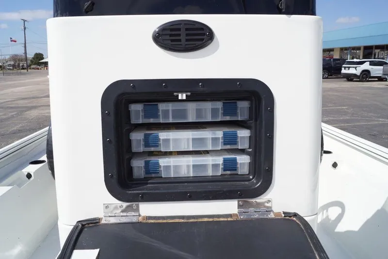 Slide: The Image of Storage compartment on 2026 Excel 230 Bay Pro Elite boat with tackle boxes. - 3