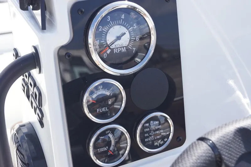 Slide: The Image of Dashboard of 2026 Excel 230 Bay Pro Elite boat with RPM, fuel, and trim gauges. - 7
