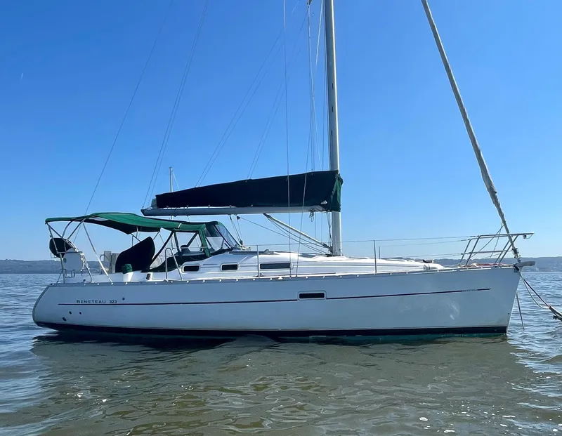 The Image of 2005 Beneteau 323 sailboat on calm water. - 0