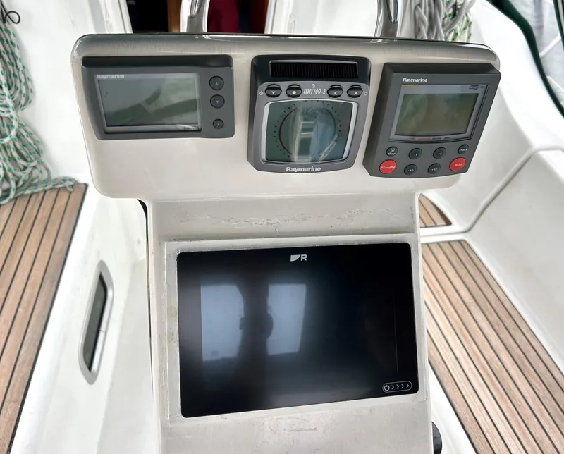 Slide: The Image of 2005 Beneteau 323 sailboat on calm waters. - 10