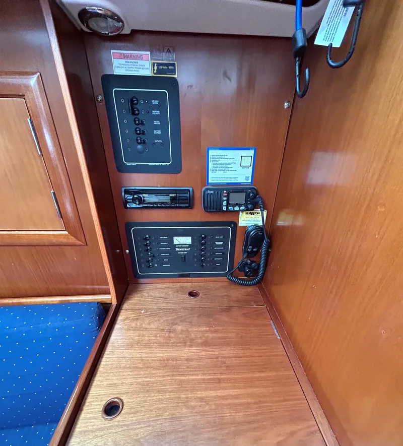 Slide: The Image of Interior of a 2005 Beneteau 323 yacht with wooden furnishings. - 15