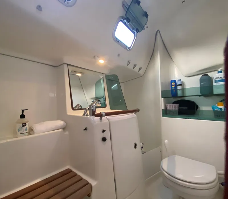 Slide: The Image of Interior of a 2005 Beneteau 323 yacht with kitchen and stairs. - 16