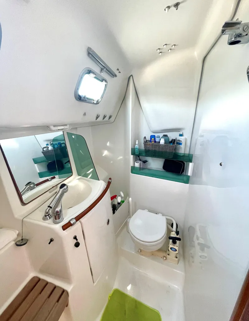 Slide: The Image of Interior of a 2005 Beneteau 323 yacht with cozy bed. - 19