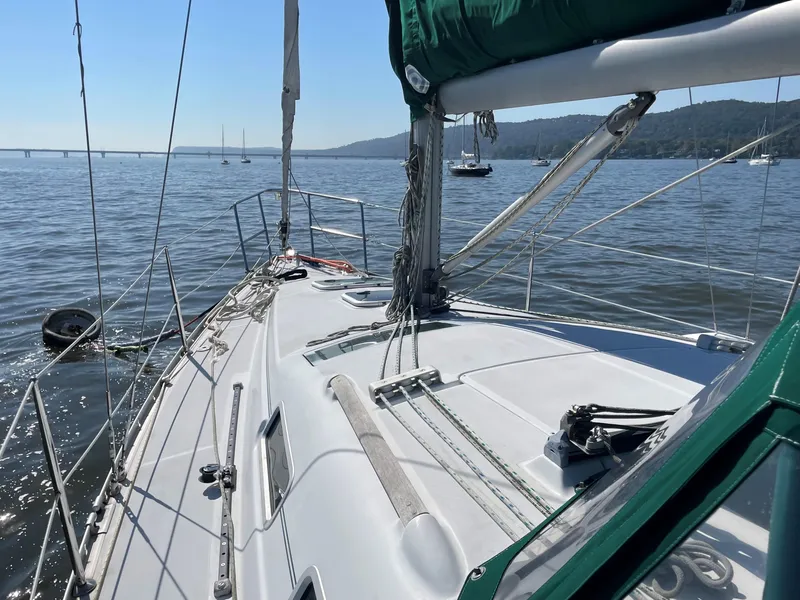 Slide: The Image of Interior view of a 2005 Beneteau 323 yacht on calm waters. - 7