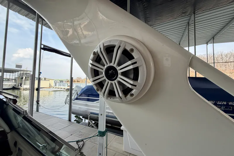 Slide: The Image of Speaker on a 1995 Sea Ray 380 Sun Sport boat docked at a marina. - 10