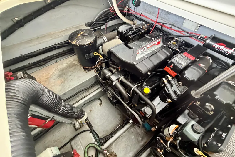 Slide: The Image of Engine compartment of a 1995 Sea Ray 380 Sun Sport boat, showcasing mechanical components. - 18