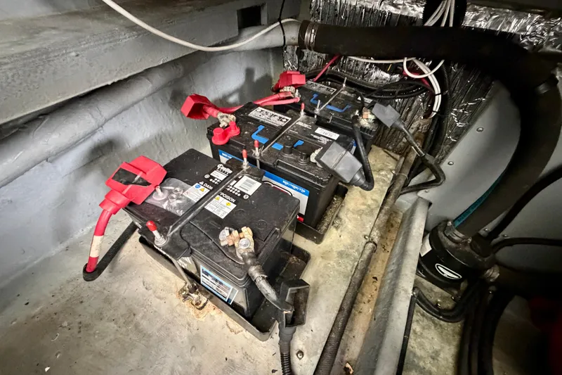 Slide: The Image of Batteries in the engine compartment of a 1995 Sea Ray 380 Sun Sport boat. - 20