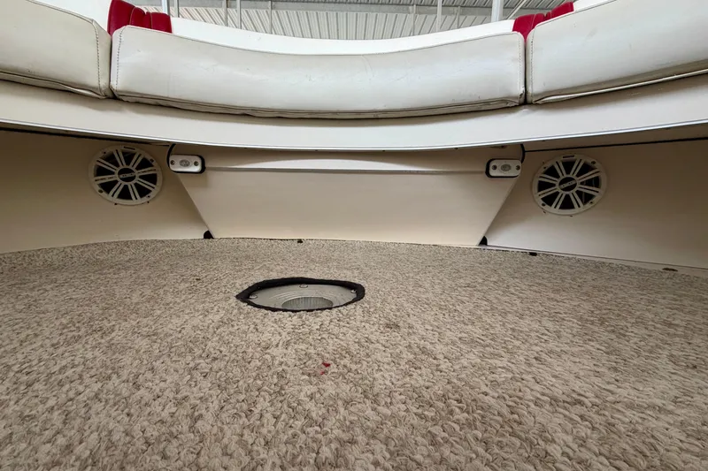 Slide: The Image of Interior of 1995 Sea Ray 380 Sun Sport boat with carpeted floor and speakers. - 24