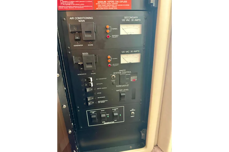 Slide: The Image of Control panel of a 1995 Sea Ray 380 Sun Sport boat, featuring various switches and gauges. - 31