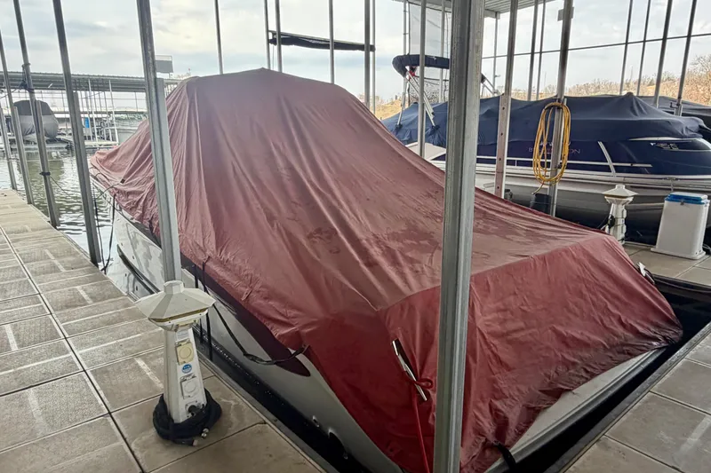 Slide: The Image of Covered 1995 Sea Ray 380 Sun Sport docked in marina. - 4