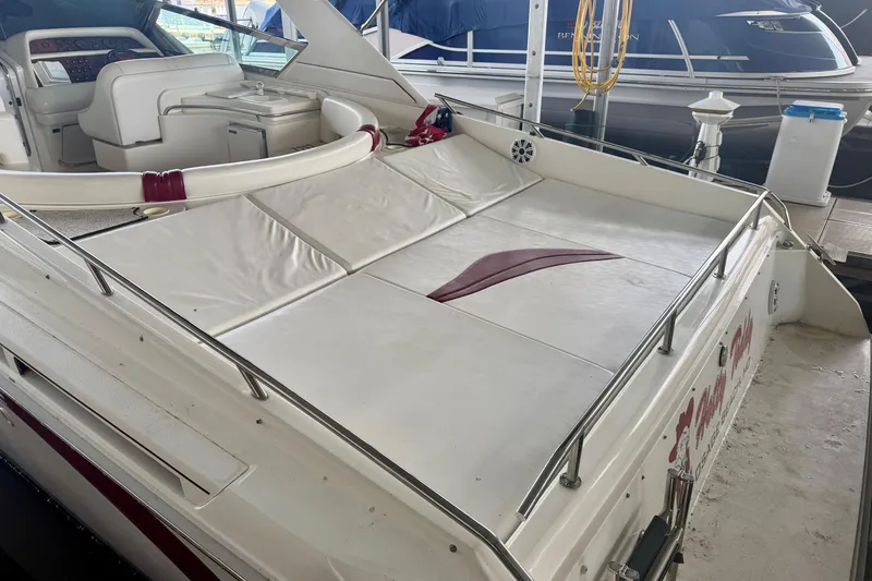 Slide: The Image of 1995 Sea Ray 380 Sun Sport boat with spacious deck and seating area. - 6