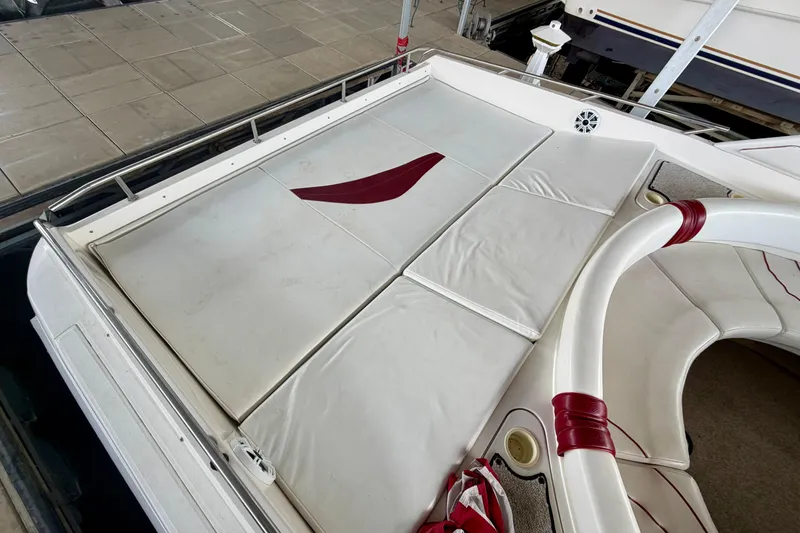 Slide: The Image of 1995 Sea Ray 380 Sun Sport boat interior with white and red seating. - 7