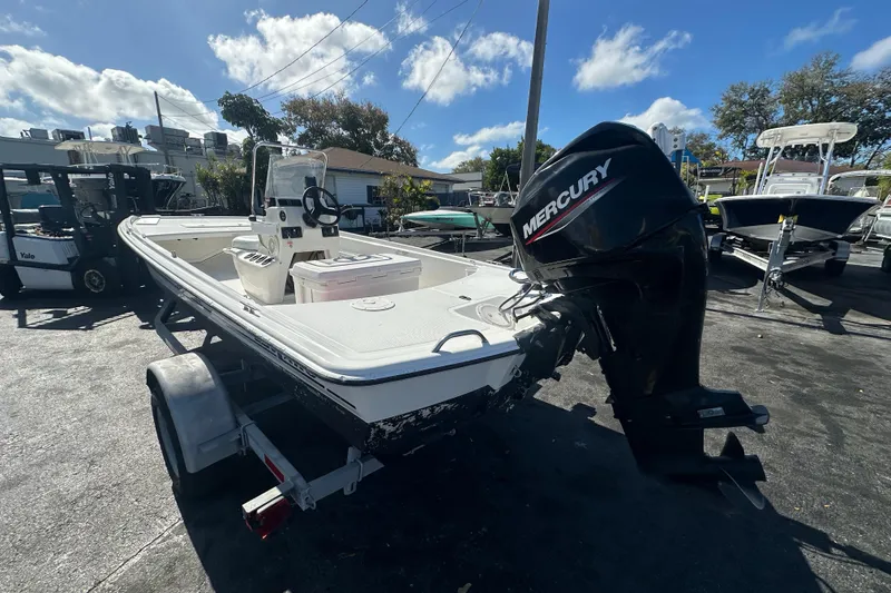 Slide: The Image of 2015 Mako Pro Skiff 17 CC boat with Mercury outboard motor on trailer. - 4