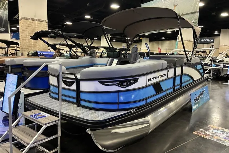 The Image of 2026 Bennington 22 MSB pontoon boat displayed indoors with sleek design and modern features. - 1