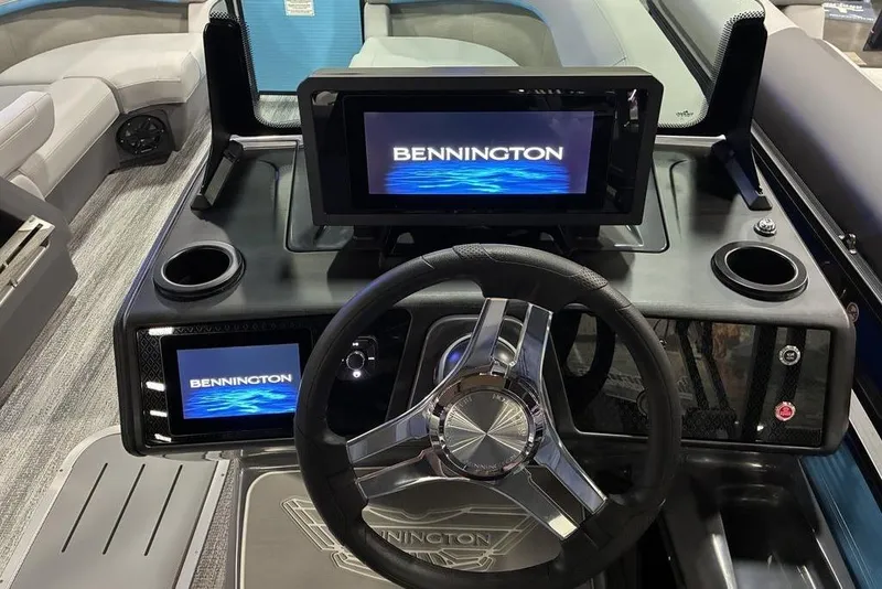 Slide: The Image of 2026 Bennington 22 MSB boat dashboard with modern steering and digital displays. - 3