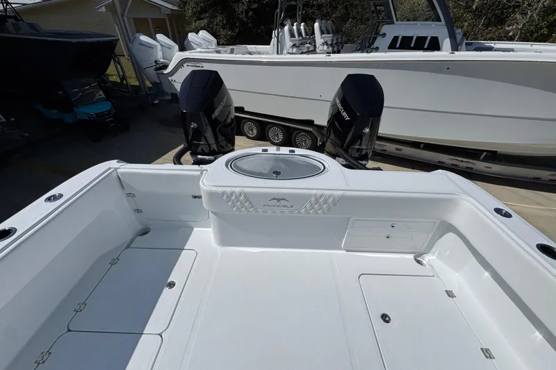 Slide: The Image of 2026 Invincible 33 Catamaran with dual Mercury engines, spacious deck, and modern design. - 40