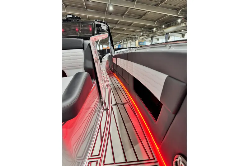 Slide: The Image of 2024 Cigarette 41' Nighthawk SD Edition interior with sleek design and red LED lighting. - 11