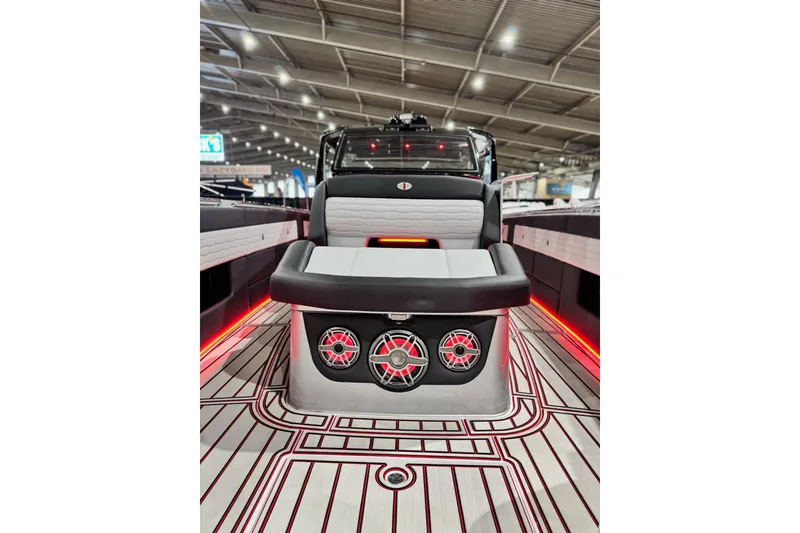Slide: The Image of 2024 Cigarette 41' Nighthawk SD Edition boat interior with stylish seating and vibrant lighting. - 13