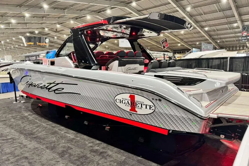 Slide: The Image of 2024 Cigarette 41' Nighthawk SD Edition boat displayed at an indoor exhibition. - 3